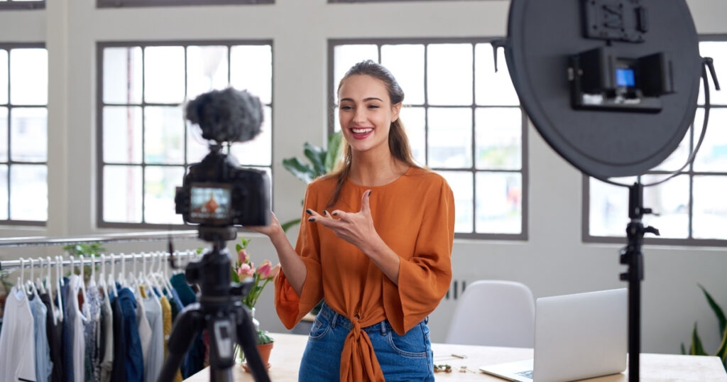 Girl speaking in front of a camera to make money on Instagram