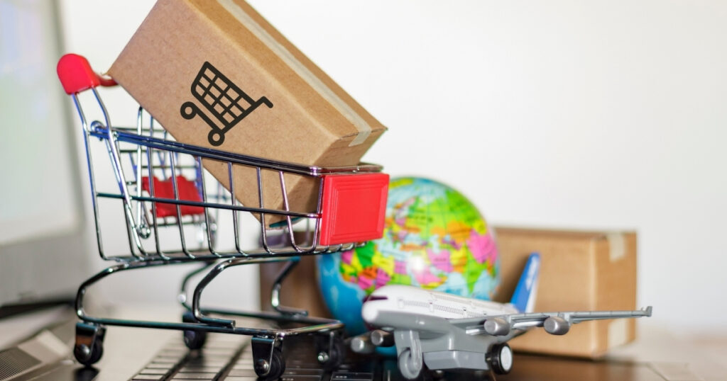 A shopping cart with a globe in the background