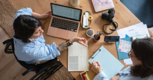 Two women sitting at a computer